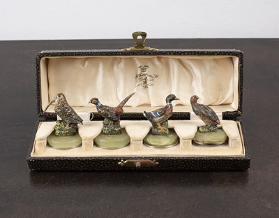 Lot 334 - Set of four cold painted menu/name holders in...