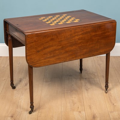 Lot 517 - A George III mahogany games table with drop leaves