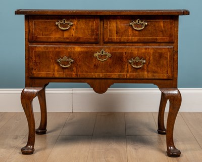 Lot 422 - An early George III walnut side table or lowboy