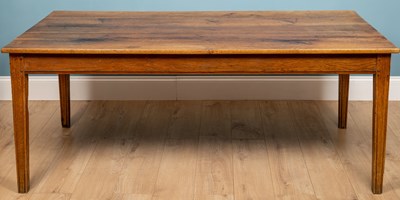 Lot 39 - An oak rectangular kitchen table with square...