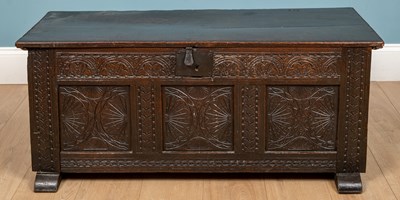 Lot 303 - An antique English carved oak coffer