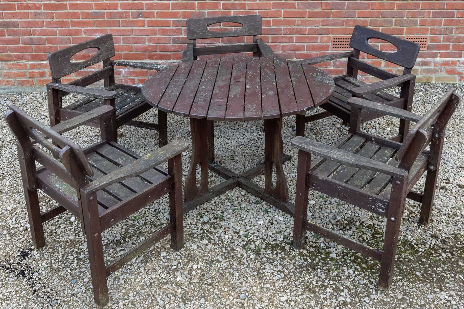 Lot 1161 - A stained teak circular garden table by Swan of Hattersley