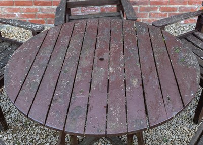 Lot 1161 - A stained teak circular garden table by Swan of Hattersley