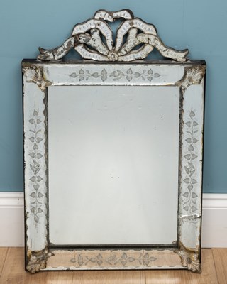 Lot 239 - A Venetian rectangular wall mirror with ribbon...