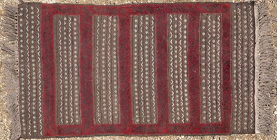 Lot 106 - A striped maroon rug together with a further small rug