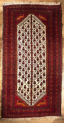 Lot 89 - Red and cream ground rug Afghanistan, with...