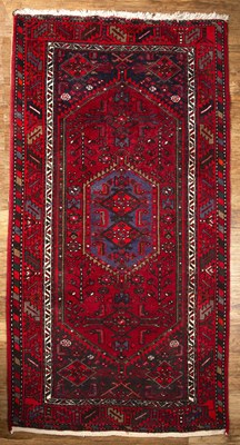 Lot 87 - Blue and red ground rug Pakistan, with central...