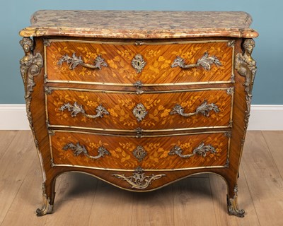 Lot 570 - A 19th century French mahogany bombe commode