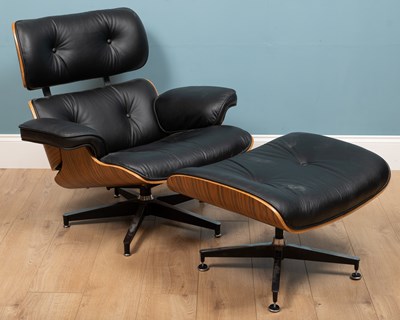 Lot 195 - An after Eames lounge chair and ottoman, black...