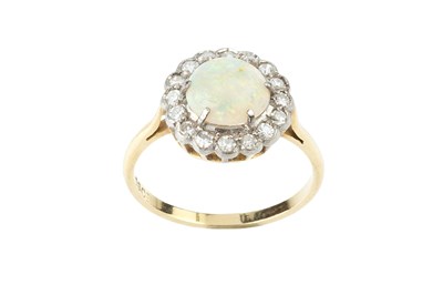 Lot 43 - An opal and diamond cluster ring, the slightly...
