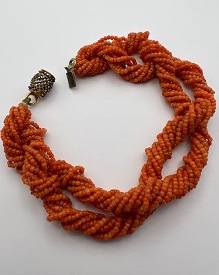 Lot 31 - A coral bead torsade necklace and bracelet...