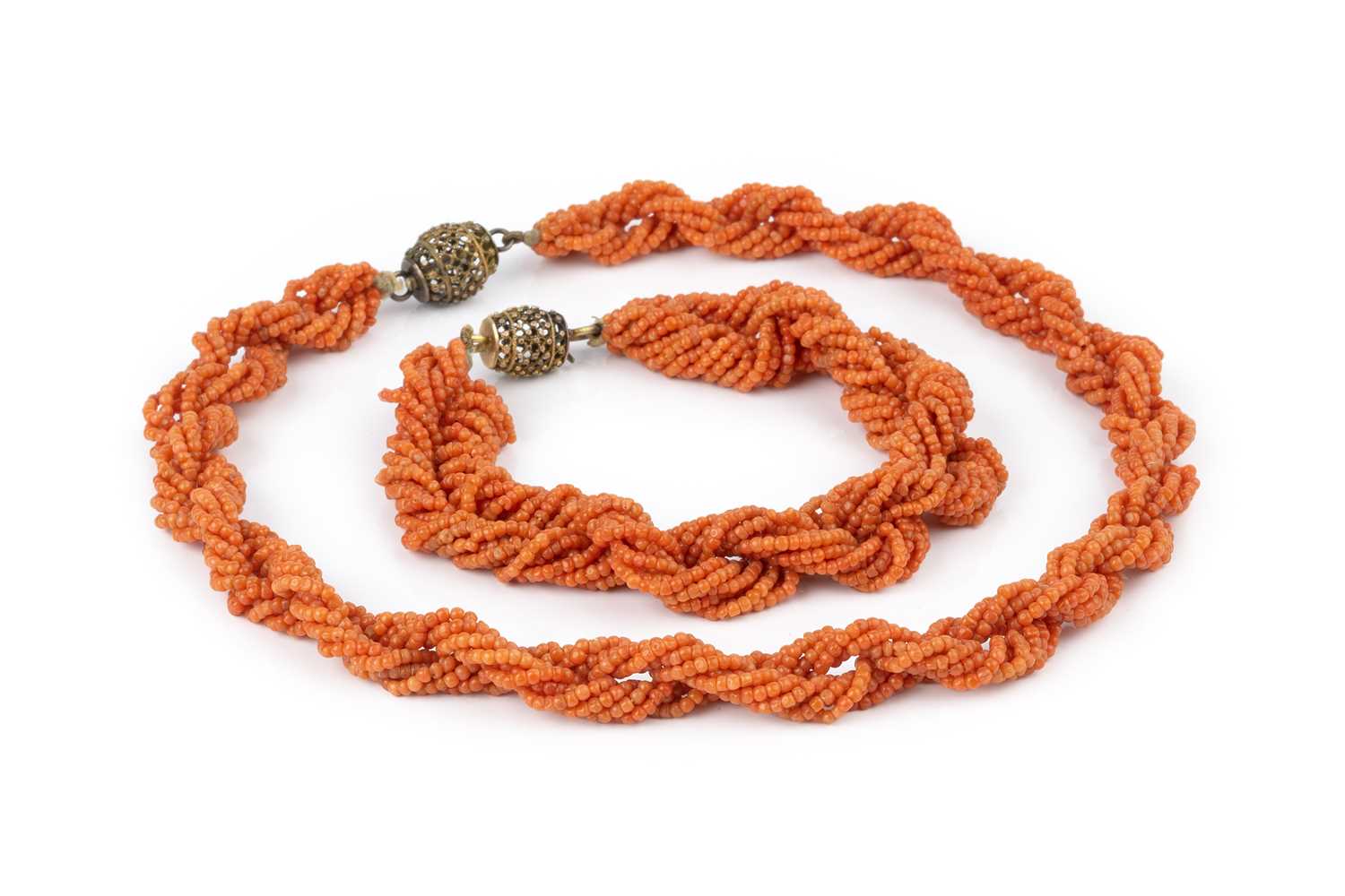 Lot 31 - A coral bead torsade necklace and bracelet...