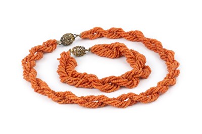 Lot 31 - A coral bead torsade necklace and bracelet...
