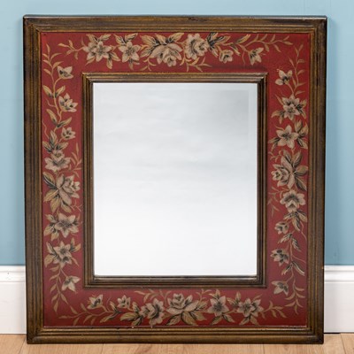 Lot 100 - A large floral mirror, deep red, painted wood,...