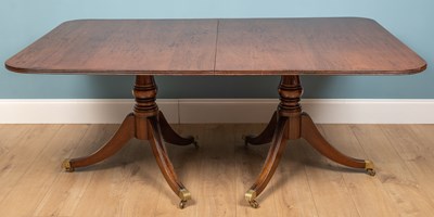 Lot 504 - A George III-style rectangular pedestal dining table