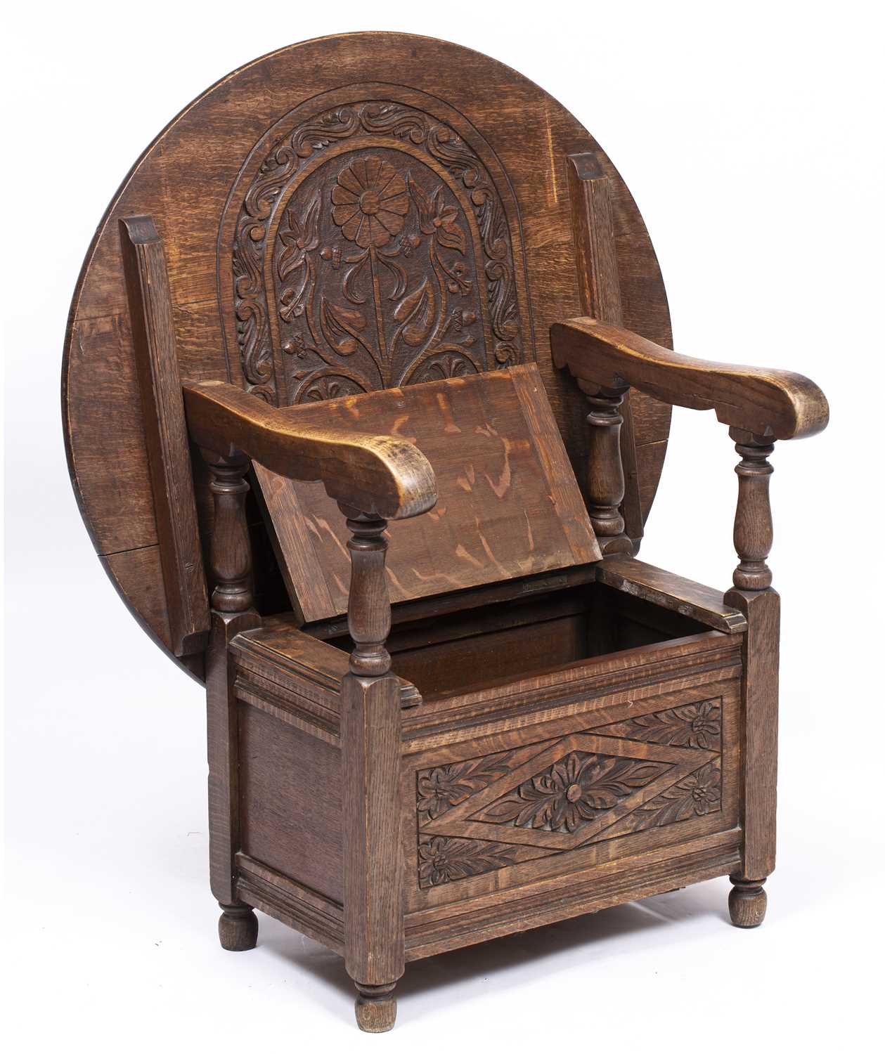 Lot 324 - An early 20th century carved oak monk's seat...