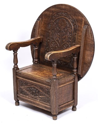 Lot 324 - An early 20th century carved oak monk's seat...