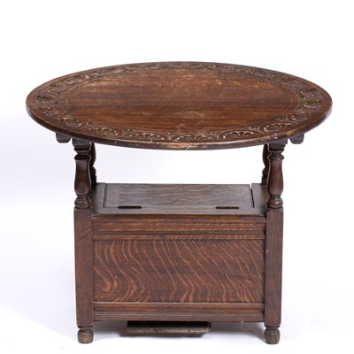 Lot 324 - An early 20th century carved oak monk's seat...