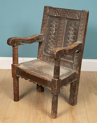 Lot 269 - An oak chair, with carved detail to the...