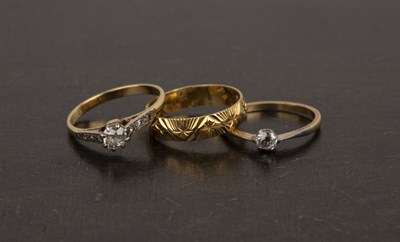 Lot 372 - Three 18ct gold rings the first a band with...