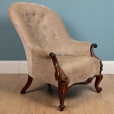 Lot 219 - A beige upholstered armchair, with ornately...