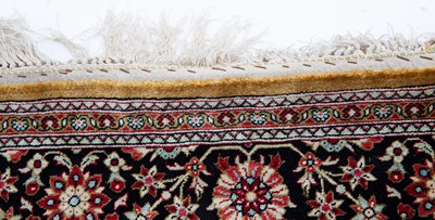 Lot 1057 - An Indian silk rug