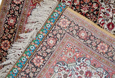 Lot 1057 - An Indian silk rug