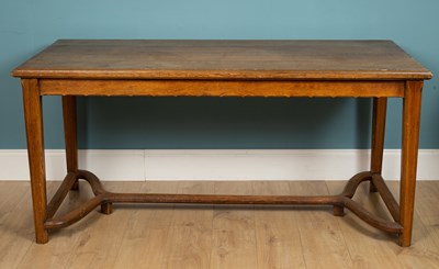 Lot 254 - An oak table with a carved stretcher base,...