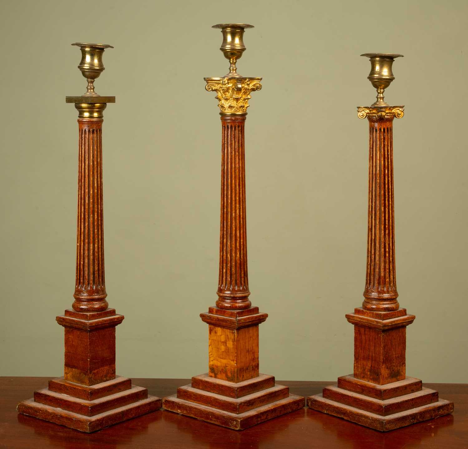 Lot 178 - A group of three similar Masonic candlesticks...