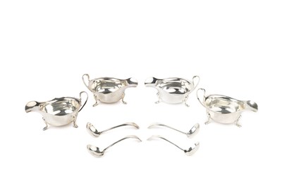 Lot 729 - A pair of George V silver sauce boats, with a...