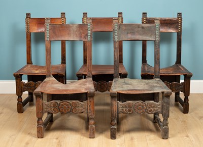 Lot 250 - A set of five leather dining chairs, with stud...