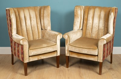 Lot 116 - A pair of Georgian style wing back armchairs...