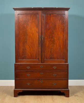 Lot 293 - A 19th century mahogany linen press the...