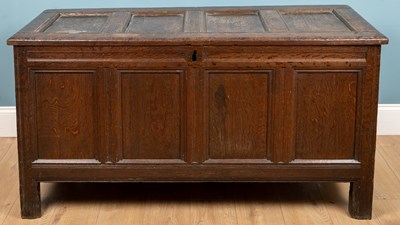 Lot 301 - An antique oak coffer with quadruple panelled...