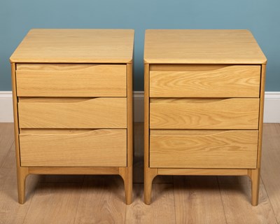 Lot 206 - A pair of Ercol Rimini bedside chests, oak,...