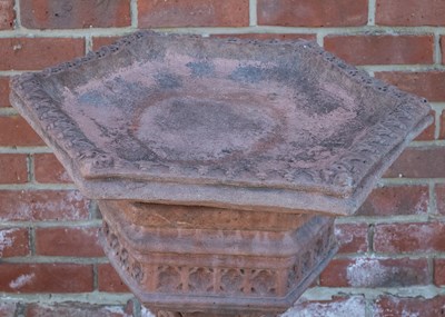 Lot 1154 - A hexagonal cast reconstituted stone terracotta coloured birdbath