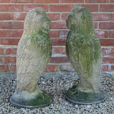 Lot 1155 - A pair of antique reconstituted stone owl sculptures