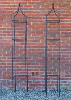 Lot 1199 - A pair of  wrought iron square section garden obelisks