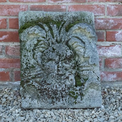 Lot 1080 - A large well weathered mossy plaque of a green man