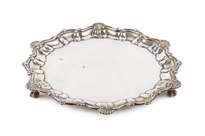 Lot 762 - A George V silver salver, with shaped scroll...