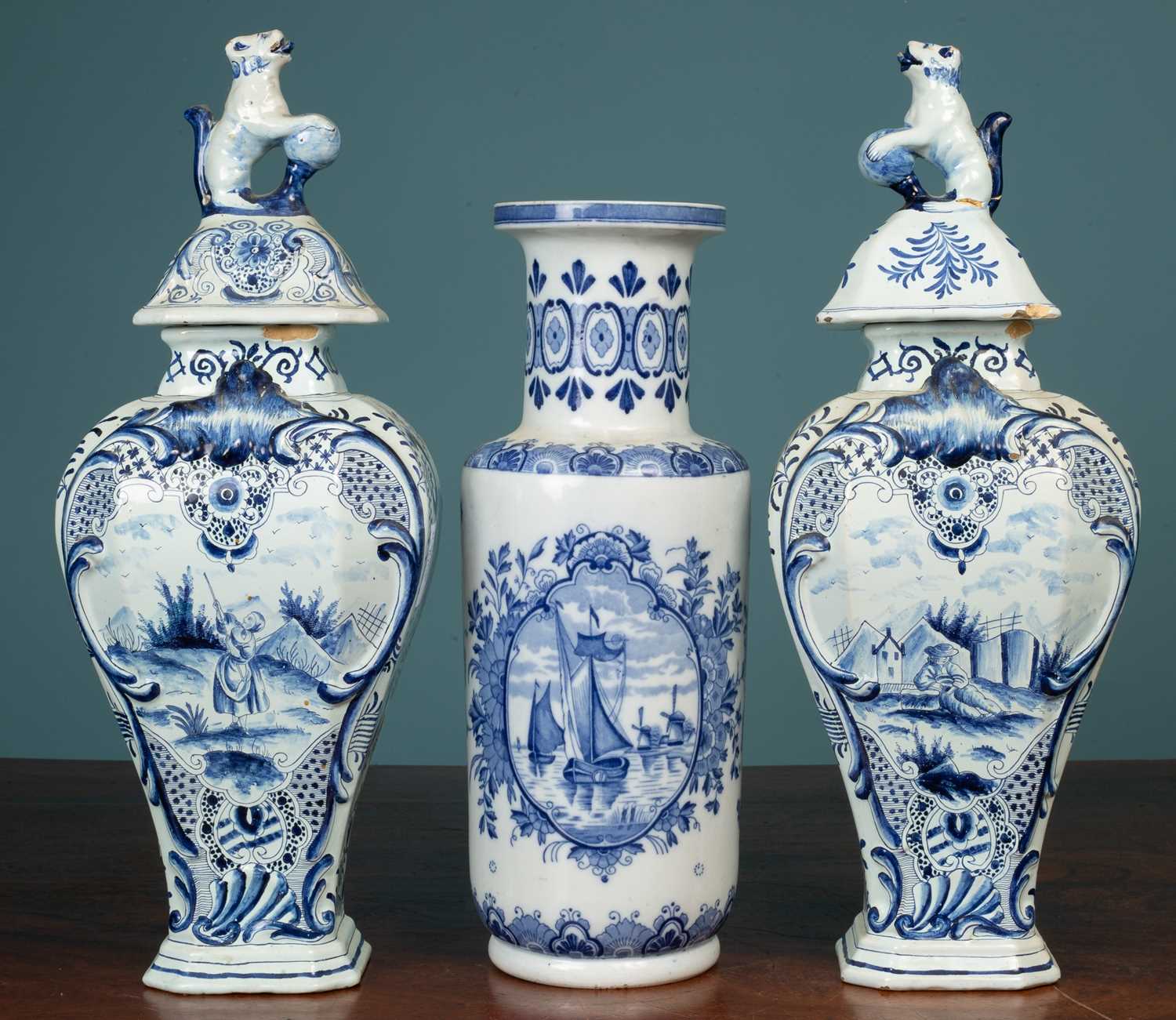 Lot 5 - A pair of Dutch Delft tin-glazed vases; together with another Dutch Delftware vase