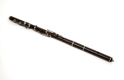 Lot 137 - A rosewood flute by Metzler and Co. London, 66....