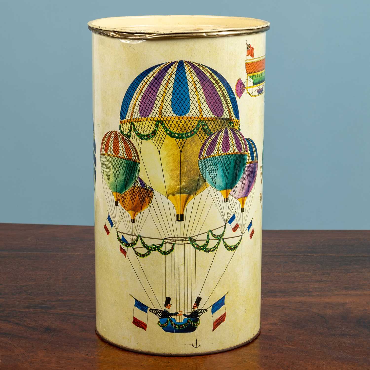 Lot 55 - A Fornasetti style tin, with a whimsical...