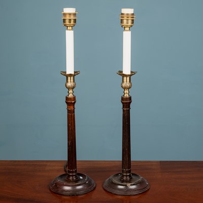 Lot 555 - A pair of Georgian style wooden fluted 'candlestick' lampstands