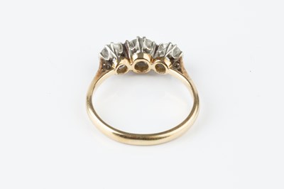 Lot 46 - A diamond three stone ring, the graduated...