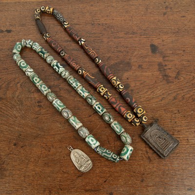 Lot 204 - Two Dzi bead necklaces Tibetan, probably...