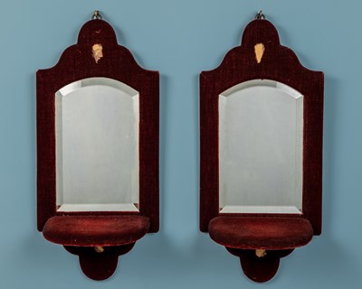 Lot 482 - A pair of burgundy velvet wall mirrors