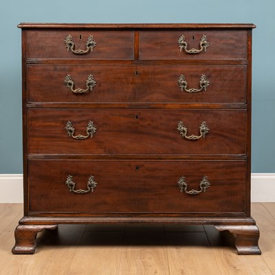 Lot 569 - A George III mahogany chest of two short drawers and three long drawers