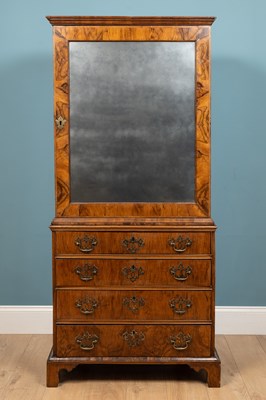 Lot 543 - An 18th century walnut cabinet on chest