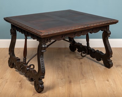 Lot 173 - A Spanish Baroque Revival walnut dining table